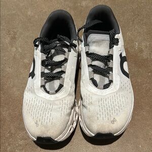 On Running White and Black Athletic Shoes